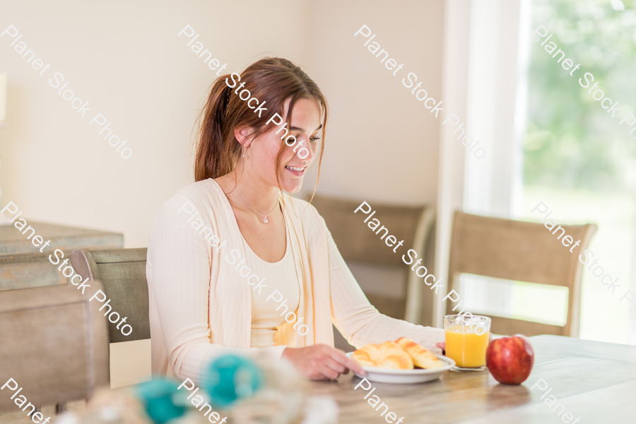 A young lady having a healthy breakfast stock photo with image ID: 9d680005-74af-4db0-a738-b4457bf0118f