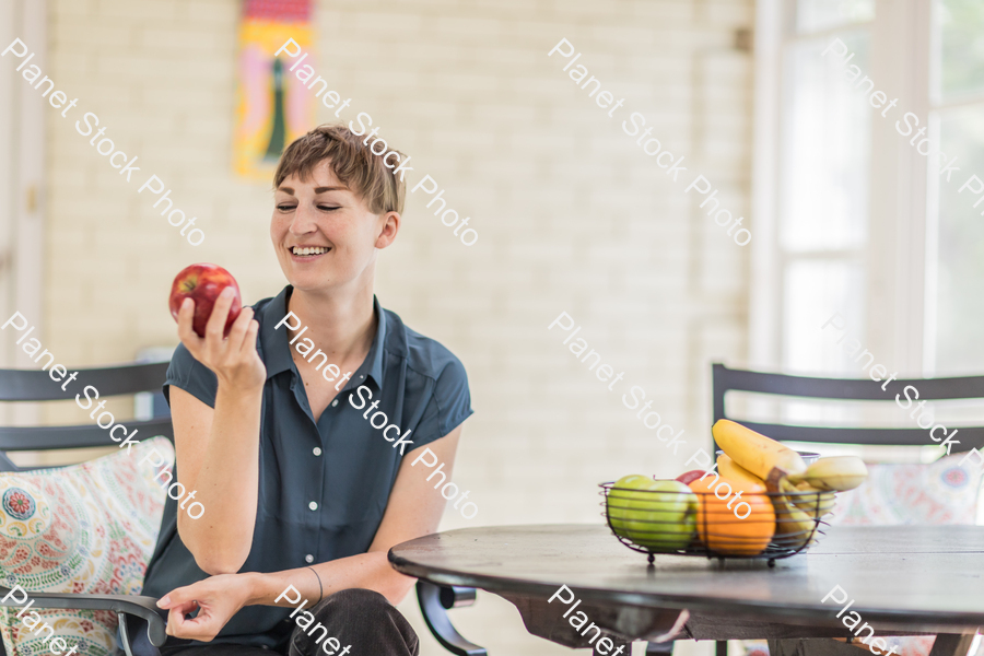 A young lady enjoying daylight at home stock photo with image ID: 9f053922-ba60-437c-bafd-c798791a404c