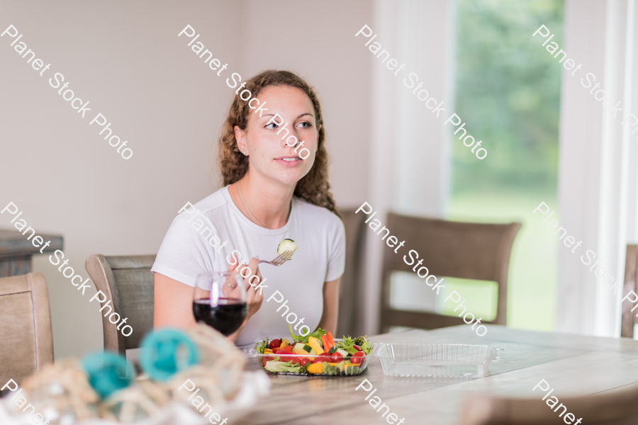 A young lady having a healthy meal stock photo with image ID: a00df696-57b2-4971-8e32-05408abd7b3c