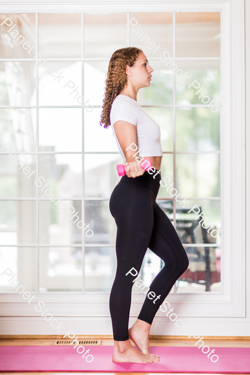 A young lady working out at home stock photo with image ID: a08e2d29-0621-4db8-be51-120a4964ca83