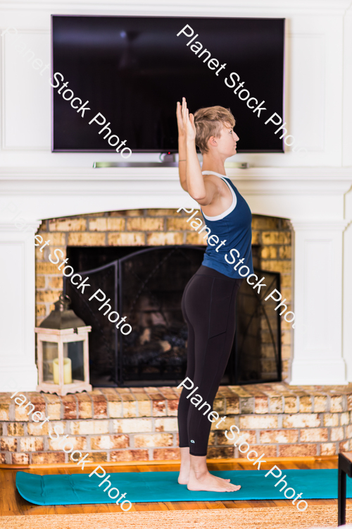 A young lady working out at home stock photo with image ID: a136a6c4-7c08-4547-8eba-2681f86eaefd