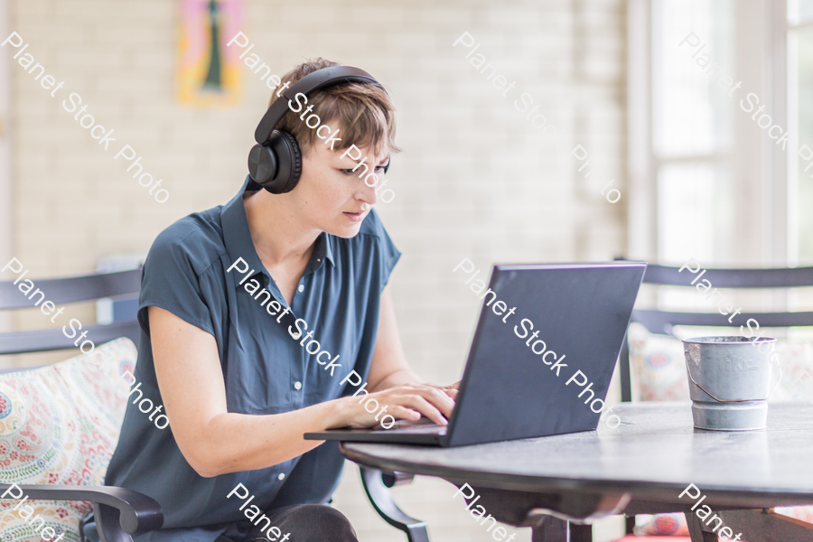 A young lady enjoying daylight at home stock photo with image ID: a522b13f-385b-4391-b140-909b0d411ac7