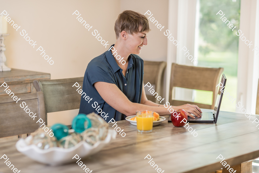 A young lady having a healthy breakfast stock photo with image ID: a68437ac-b819-4aed-beb6-066b813d6ad0