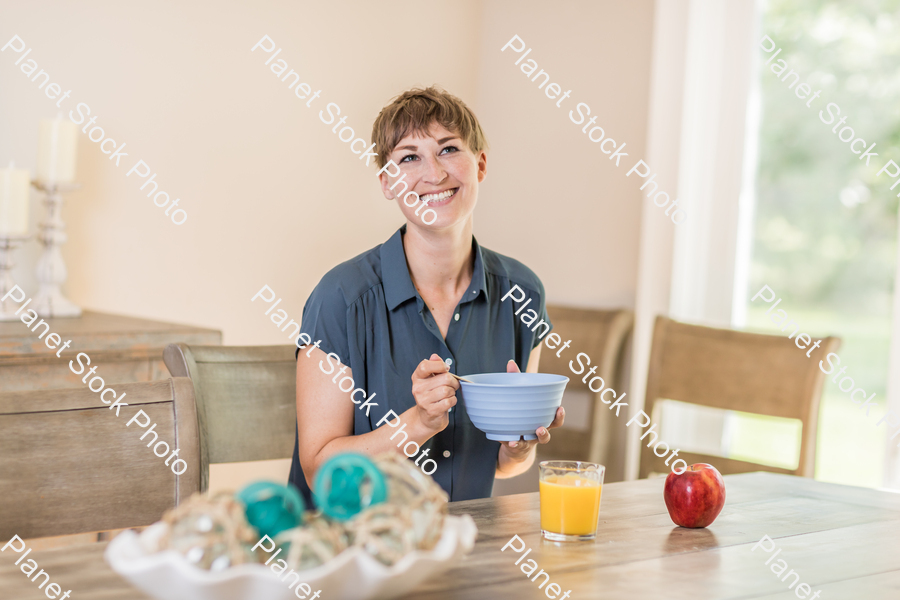 A young lady having a healthy breakfast stock photo with image ID: a6c7b872-abd6-4f43-86e8-7ed599286be3
