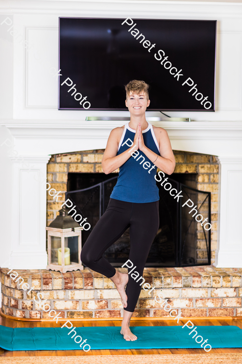 A young lady working out at home stock photo with image ID: a85fbf5b-36b0-45a2-b51f-268afdb91fd0