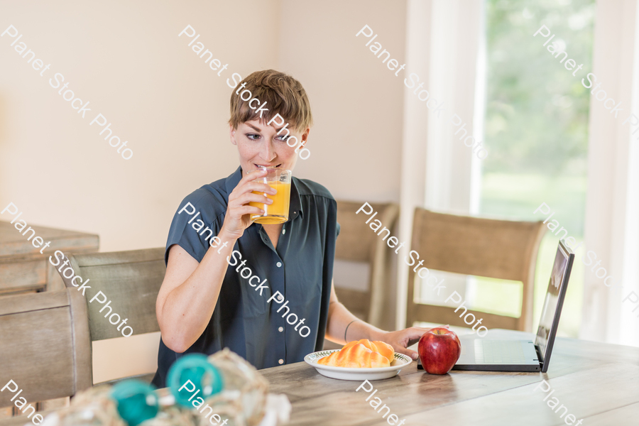 A young lady having a healthy breakfast stock photo with image ID: a900f332-1beb-43b6-a35d-ced04a38e0c2