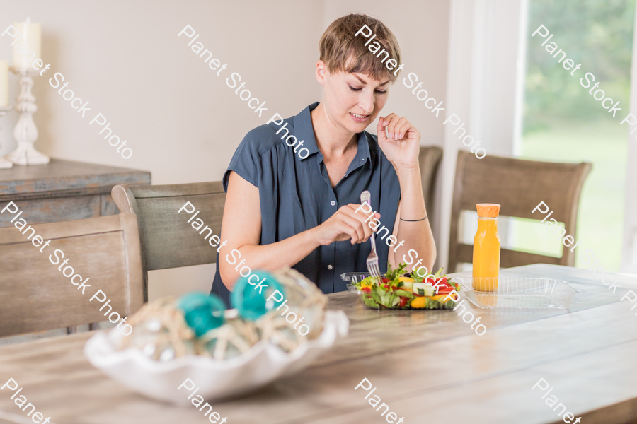 A young lady having a healthy meal stock photo with image ID: ab0cdd8a-b6b3-4a33-a298-4c415b9a4418