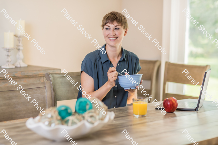 A young lady having a healthy breakfast stock photo with image ID: ac95f75d-5b8f-4c2d-b5ef-5e0ca2c4ac38