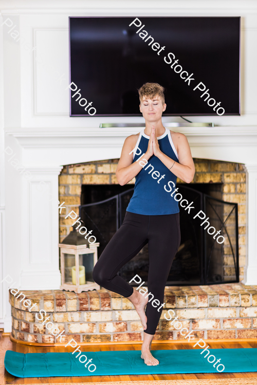 A young lady working out at home stock photo with image ID: ad2aa79f-d7dd-48c9-aa3c-1cc82b542743