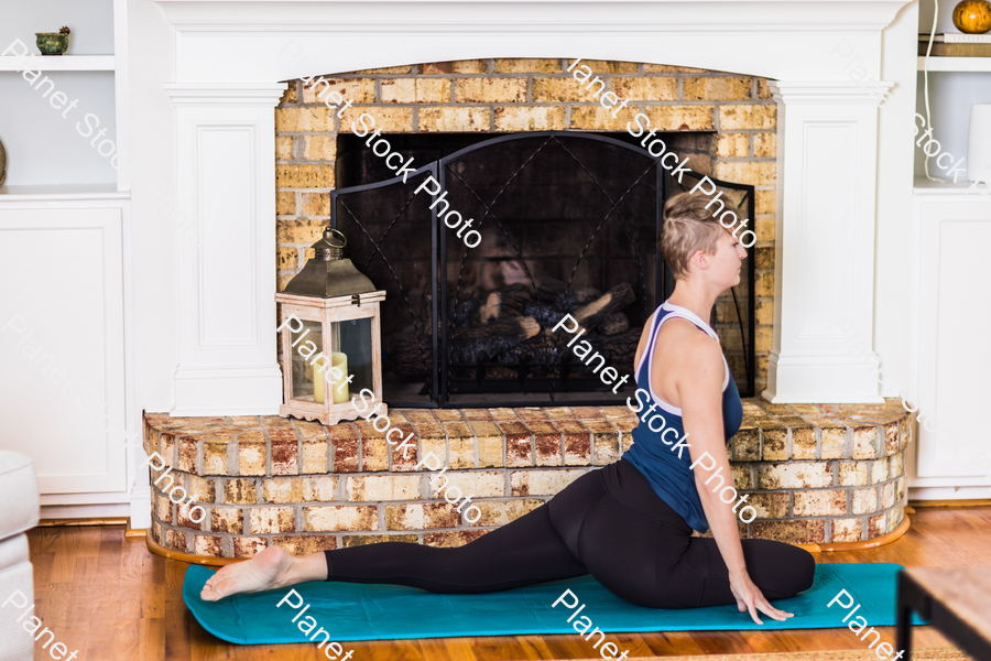 A young lady working out at home stock photo with image ID: adc00c6b-2f3f-4d0b-89b7-1334379a4802