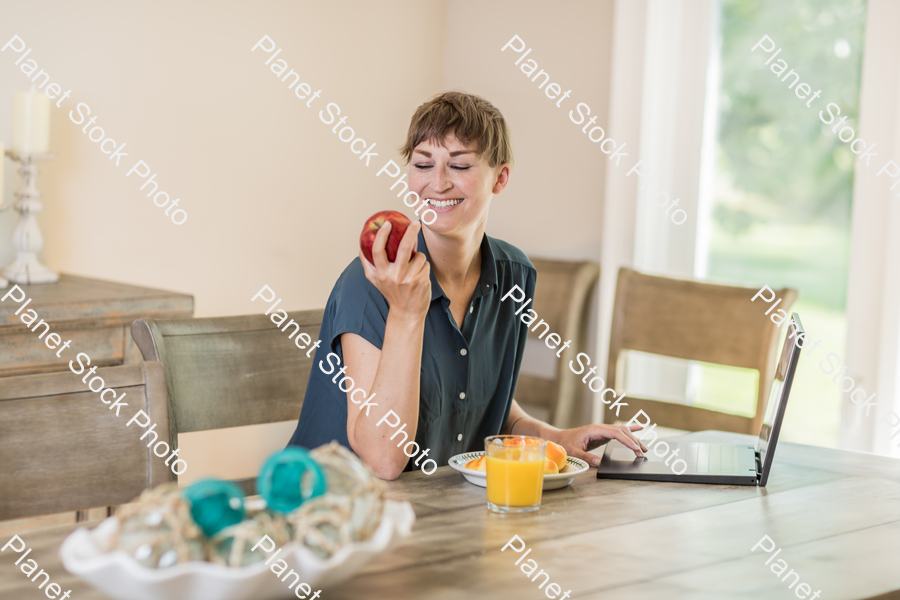 A young lady having a healthy breakfast stock photo with image ID: b031cad3-1575-47fe-90e3-32795d97b1d8