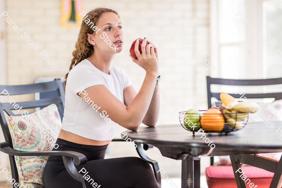 A young lady enjoying daylight at home stock photo with image ID: b540abb9-0dc5-4fae-a5ad-7fdb0bef976a