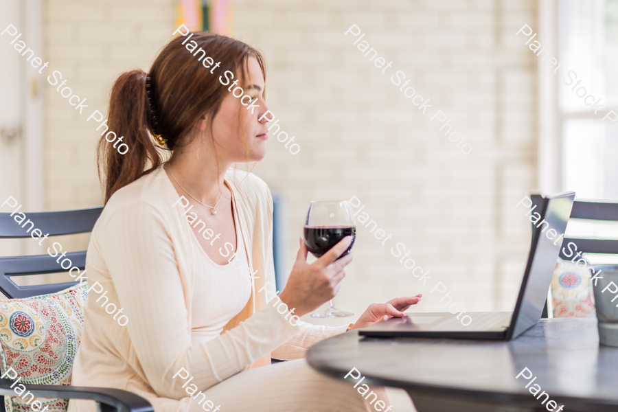 A young lady enjoying daylight at home stock photo with image ID: ba2ca16d-c44c-4f5b-9d31-9a396dc77d16