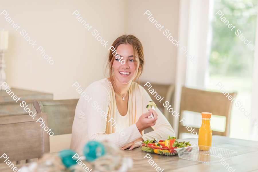 A young lady having a healthy meal stock photo with image ID: baa894d2-8c9d-4555-8b08-29d864762884