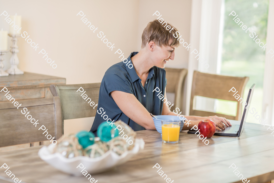 A young lady having a healthy breakfast stock photo with image ID: baf8437b-8763-4546-b0ed-1f5a72edefc0