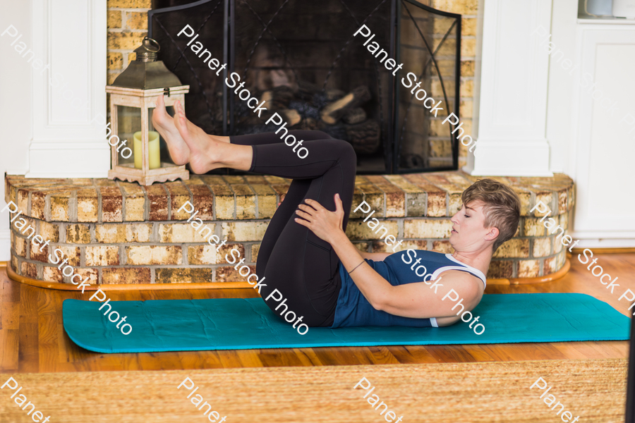 A young lady working out at home stock photo with image ID: bb3d70cb-25d9-4d73-85bf-4e99992d17f7