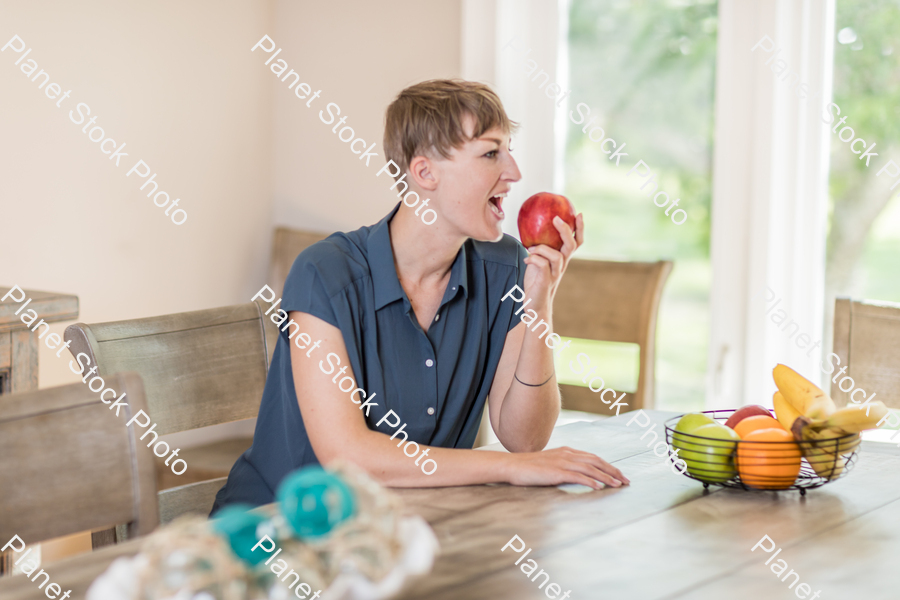A young lady grabbing fruit stock photo with image ID: bcbe6fb9-5e6c-45fc-abb9-0a2b417a9006