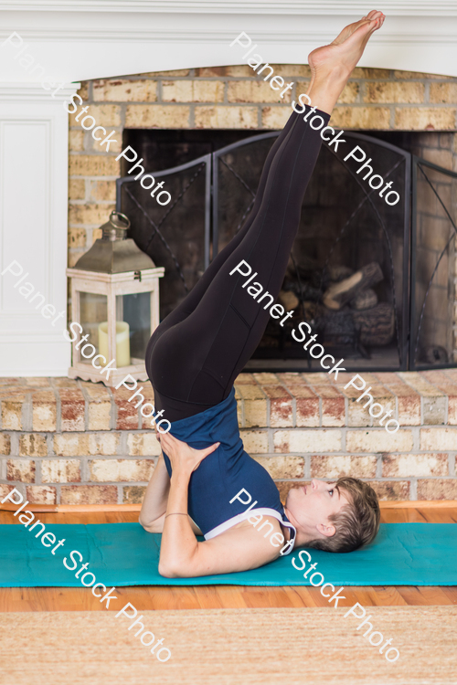 A young lady working out at home stock photo with image ID: be3bd00f-6f77-458e-9090-f634caaeac1a