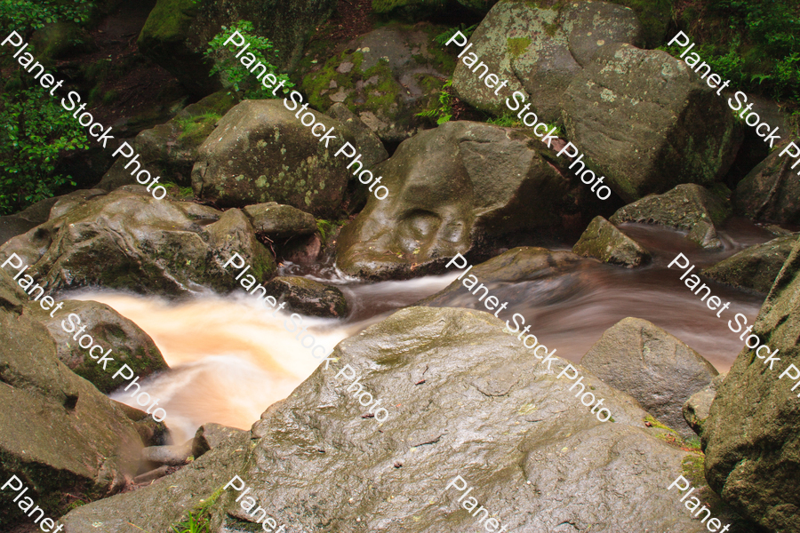 Water flowing over rocks stock photo with image ID: beb22f4a-3aba-432a-844b-334e169e58d7