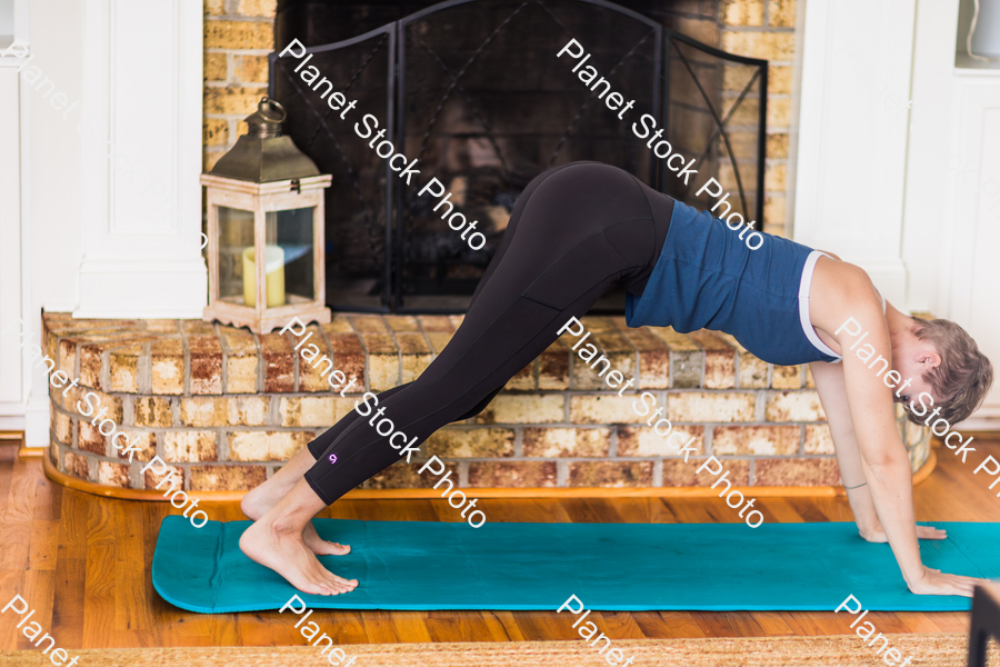 A young lady working out at home stock photo with image ID: c17d7139-67b8-46b6-9a13-58789c70de95