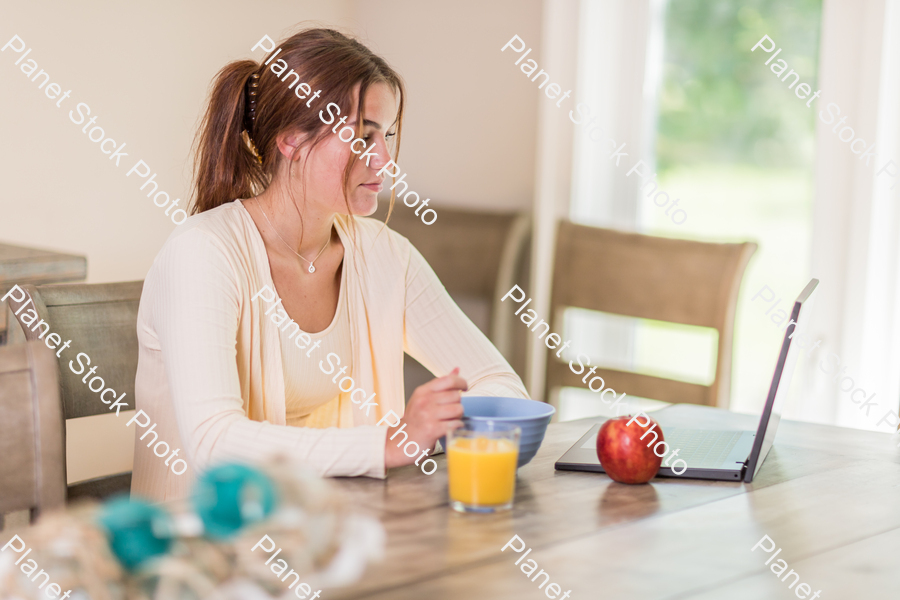 A young lady having a healthy breakfast stock photo with image ID: c1ac09e8-a668-4c7a-9a06-a1ee81799cfb