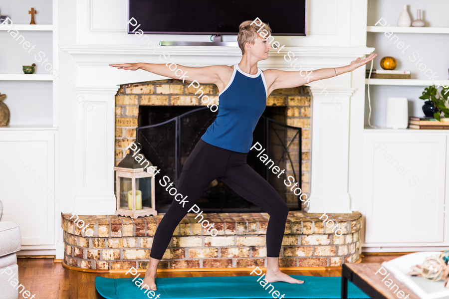A young lady working out at home stock photo with image ID: c20e822c-dfe1-482f-890f-21a109d106b7