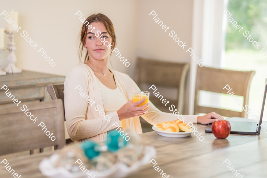 A young lady having a healthy breakfast stock photo with image ID: c2be4de7-3955-4d19-8b31-3dc2710ed4f3