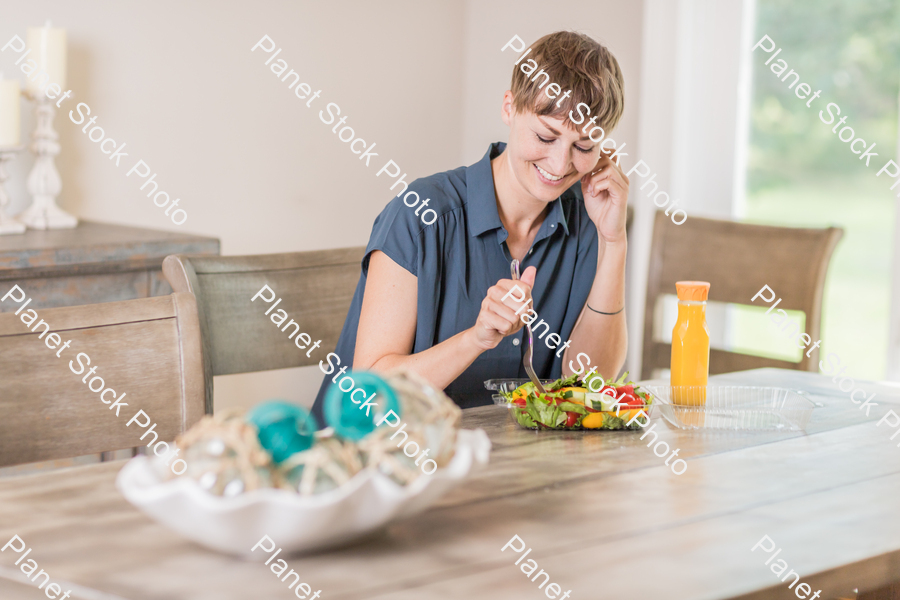 A young lady having a healthy meal stock photo with image ID: c31f22a9-1b8f-45e5-8e7f-daca9329407b