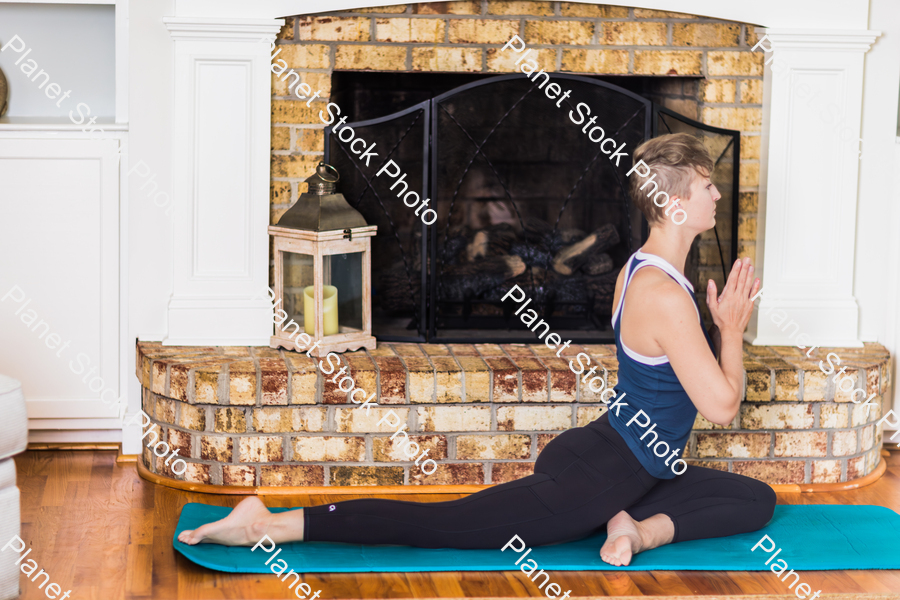 A young lady working out at home stock photo with image ID: c4f58769-be34-4926-9273-c583a3d093c9