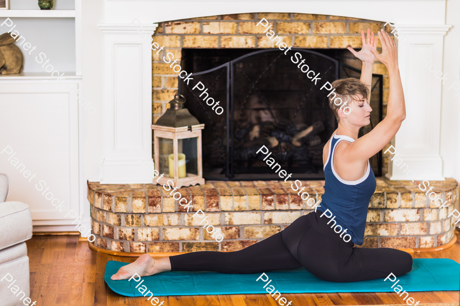 A young lady working out at home stock photo with image ID: c527bba7-3771-46f1-9308-567eea80d092