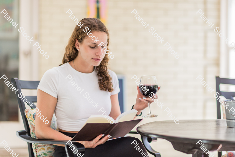 A young lady enjoying daylight at home stock photo with image ID: ca090621-4e7a-4724-9d86-6c0ca53f1980