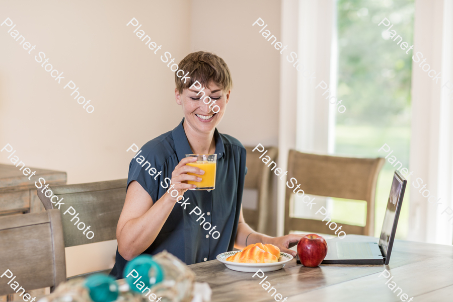 A young lady having a healthy breakfast stock photo with image ID: cb69ad9b-ebc5-450c-aa2f-0984649a4fc9