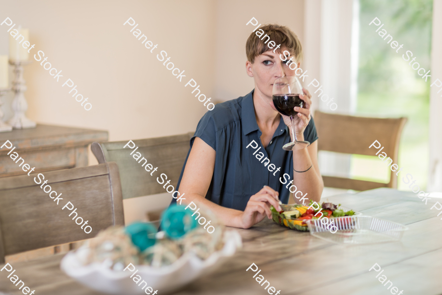 A young lady having a healthy meal stock photo with image ID: cc45365c-83b5-43f4-9b49-b26eaad6359d