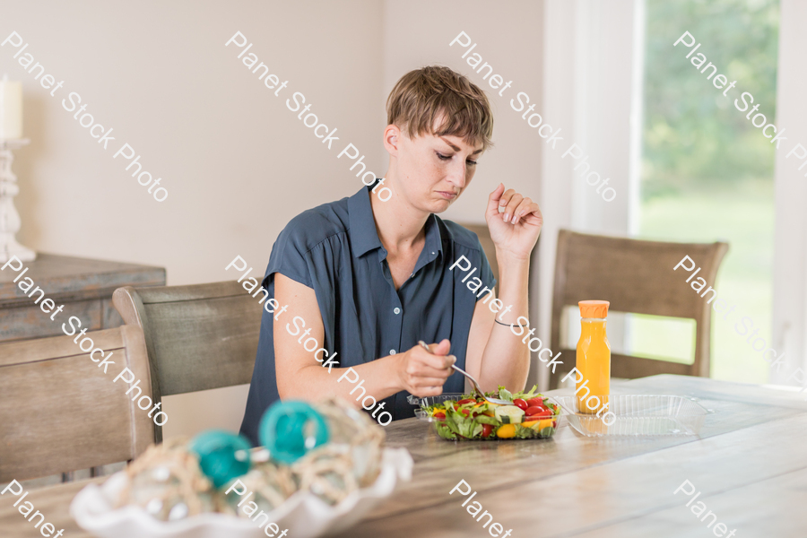 A young lady having a healthy meal stock photo with image ID: cdbe4861-f863-4eee-b1fe-e1fd345374fd