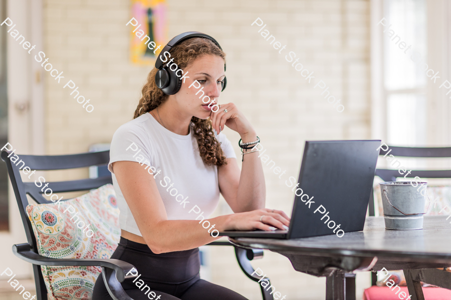 A young lady enjoying daylight at home stock photo with image ID: d0ce31ba-6a85-4771-9f4c-f41622c9830e