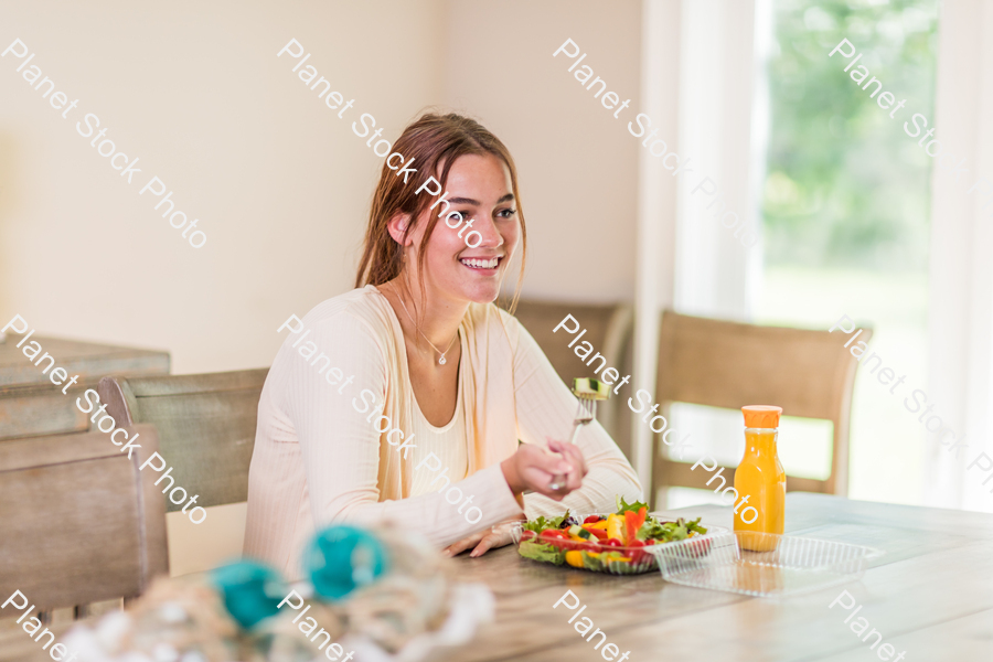 A young lady having a healthy meal stock photo with image ID: d1c6506b-72c8-4dcd-b636-ffd5a61122c5