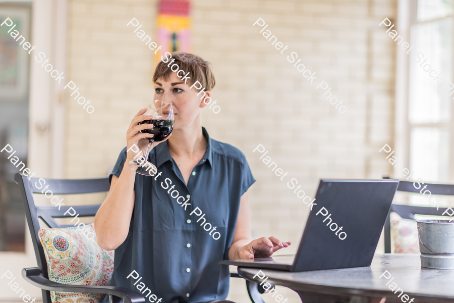 A young lady enjoying daylight at home stock photo with image ID: d2bfa92c-8a93-4547-b7d8-58e0d49d4e52