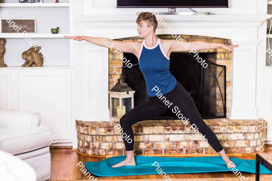 A young lady working out at home stock photo with image ID: d6b2f41d-5b34-4cdc-a384-bd0d7cb6d047