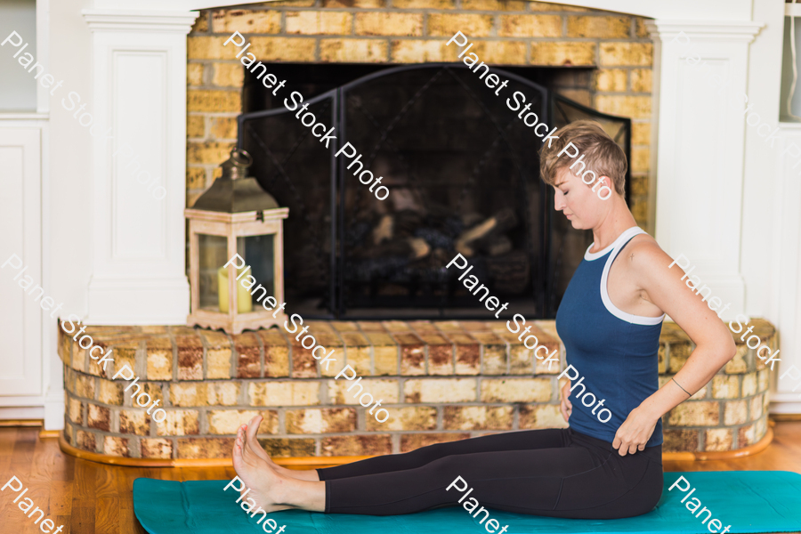 A young lady working out at home stock photo with image ID: d78ebeb3-a66c-4b6f-8dae-172942c1e7a4