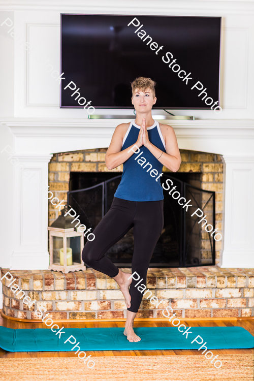 A young lady working out at home stock photo with image ID: d7c8f3be-34fe-4008-b751-4a57396f21dc