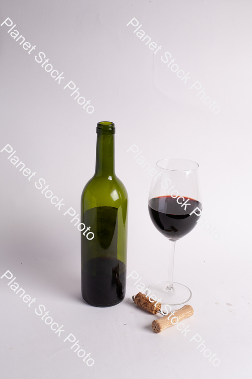 One bottle of red wine, with wine glass, and corkscrew stock photo with image ID: d8fb68b8-2ec7-4385-bd6d-6f58e052387a