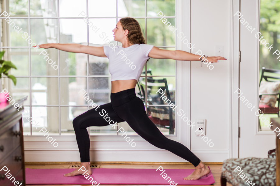 A young lady working out at home stock photo with image ID: d9f2971a-3fcc-478c-8399-114ed7479c68