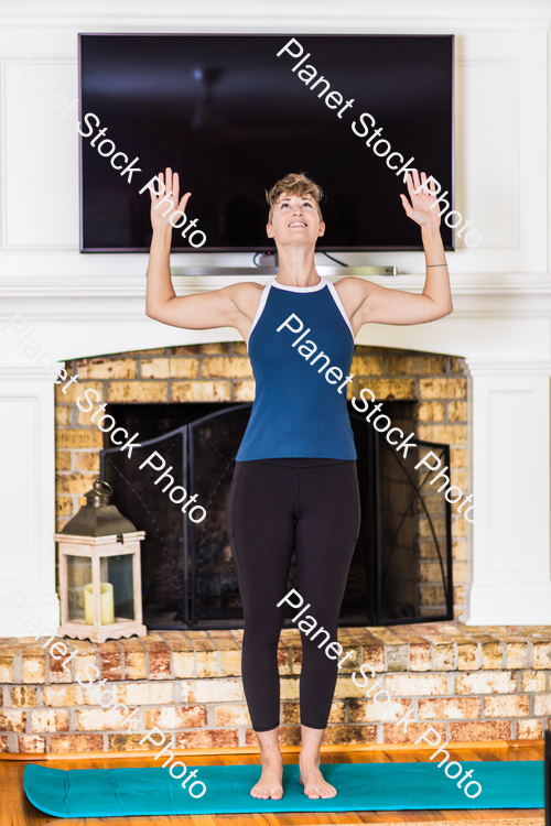 A young lady working out at home stock photo with image ID: dae334c4-10c1-4b0c-92e0-a8cc7d09bc7a