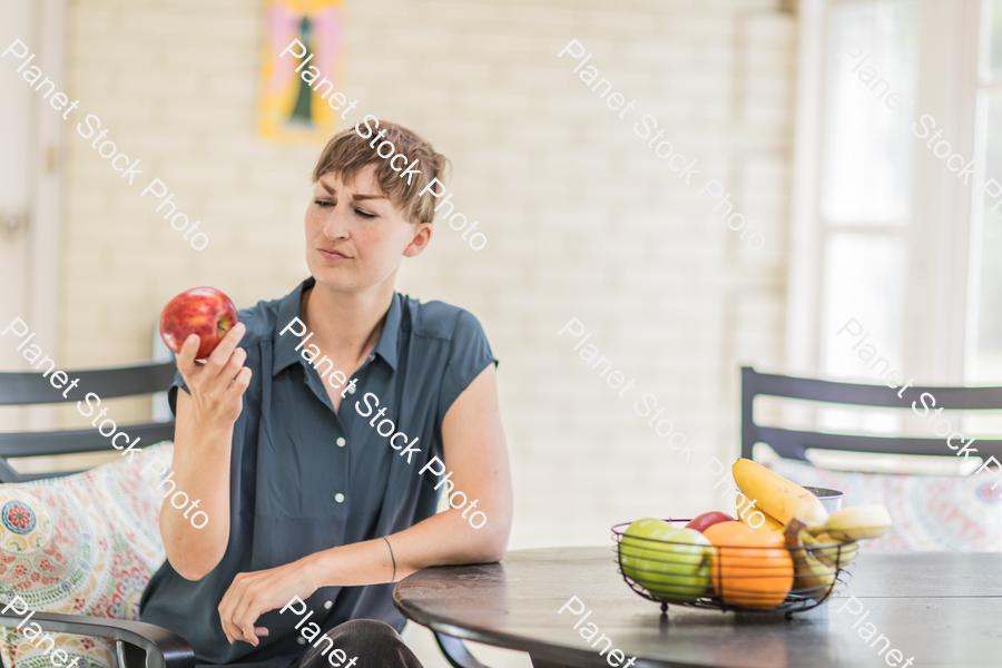 A young lady enjoying daylight at home stock photo with image ID: db338524-65a5-4866-bcb2-b0b9eadf1b60