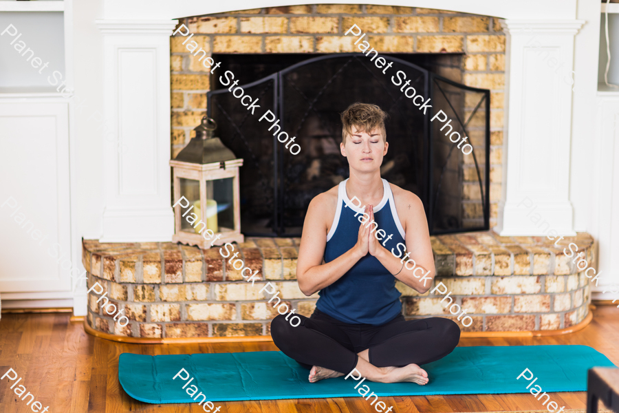 A young lady working out at home stock photo with image ID: dbcf9ccb-0a4b-4b42-8924-c12cd5dccca5