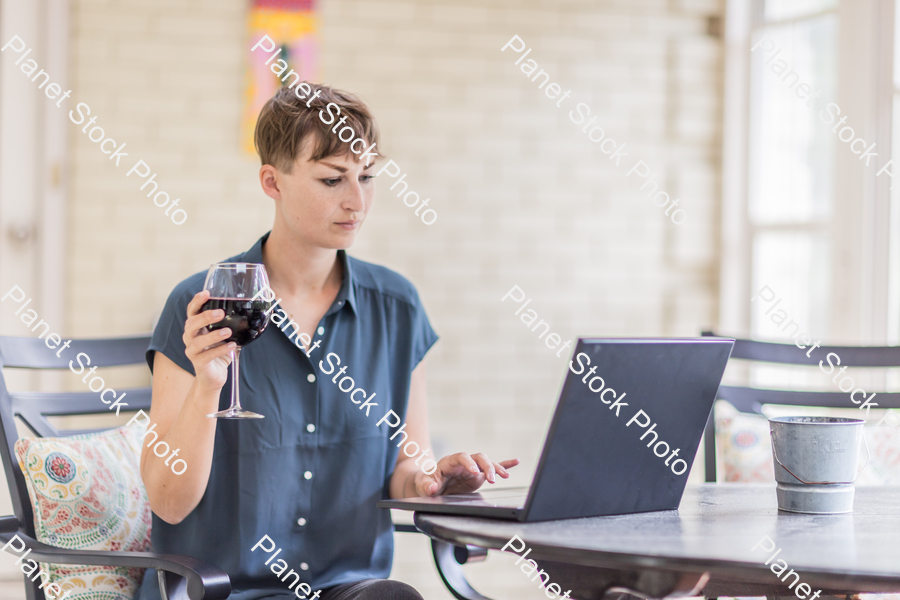 A young lady enjoying daylight at home stock photo with image ID: dcd93a9a-0e2e-48d5-9955-ac1b40f685b1