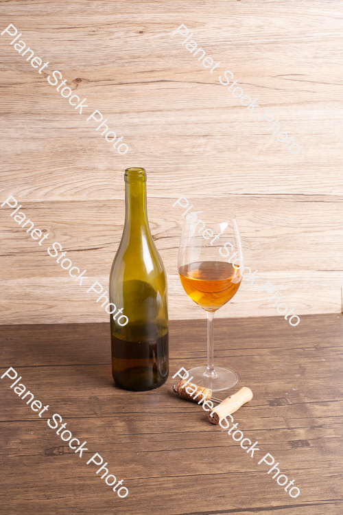 One bottle of white wine, with wine glass, and corkscrew stock photo with image ID: e191d642-1fd7-4a92-880b-2bd45dc3c367