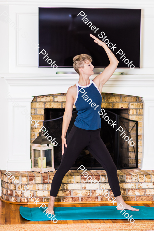 A young lady working out at home stock photo with image ID: e2b03958-e26b-4261-80ed-ec9428b393e9