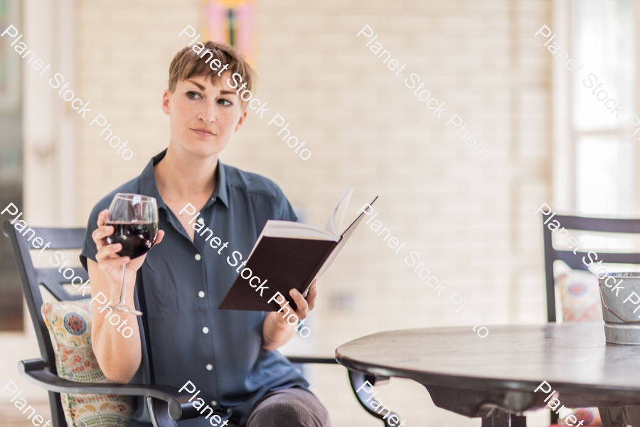 A young lady enjoying daylight at home stock photo with image ID: e48f0bb2-525f-4ffe-848c-a50fe4b0b91c