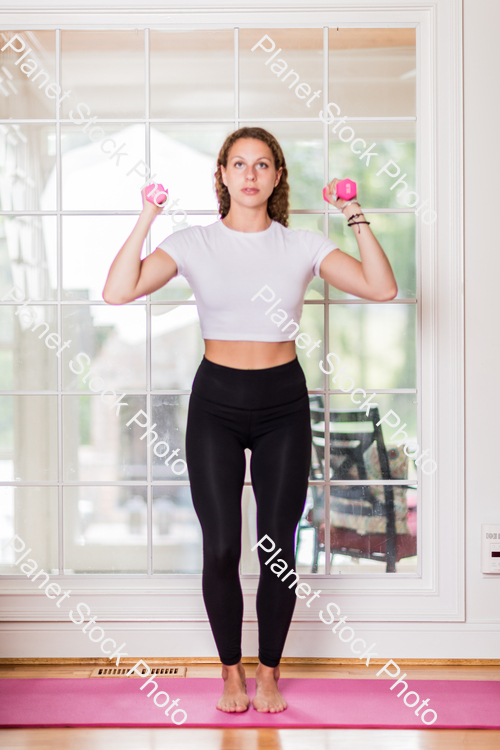 A young lady working out at home stock photo with image ID: e4c2010e-5e5c-4b20-b42b-7eb8b76c8220